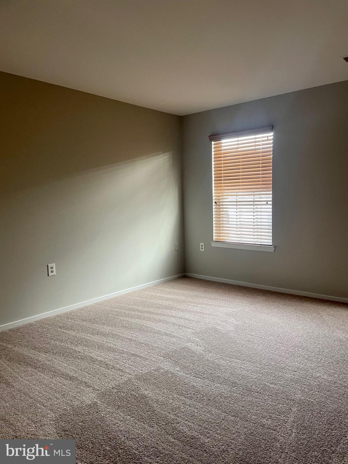 7828 Harrowgate Circle, Unit C Springfield, VA 22152 - Photo 6 of 11 an empty room with a window