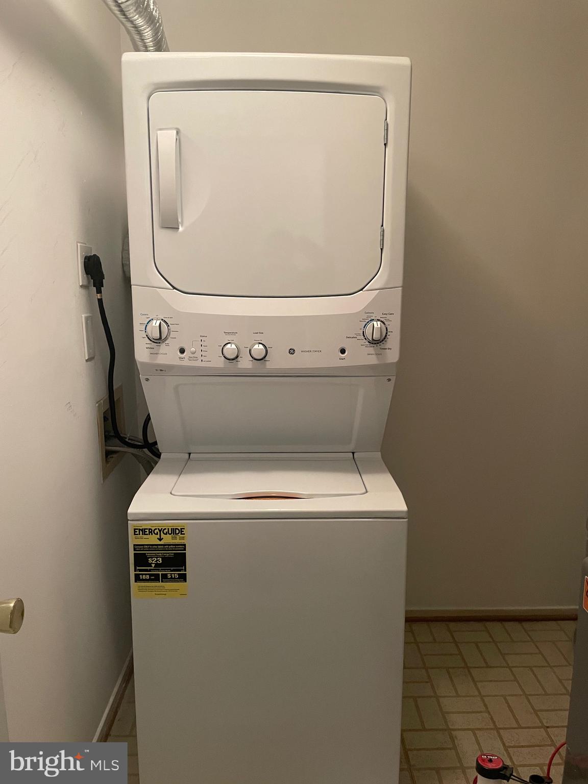 7828 Harrowgate Circle, Unit C Springfield, VA 22152 - Photo 9 of 11 a utility room with dryer and washer
