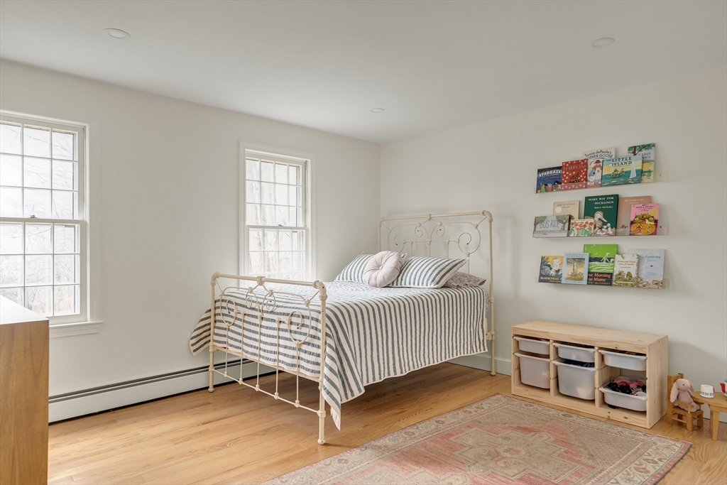 8 Highland Road Acton, MA 01720 - Photo 27 of 36 a bedroom with a bed and a window