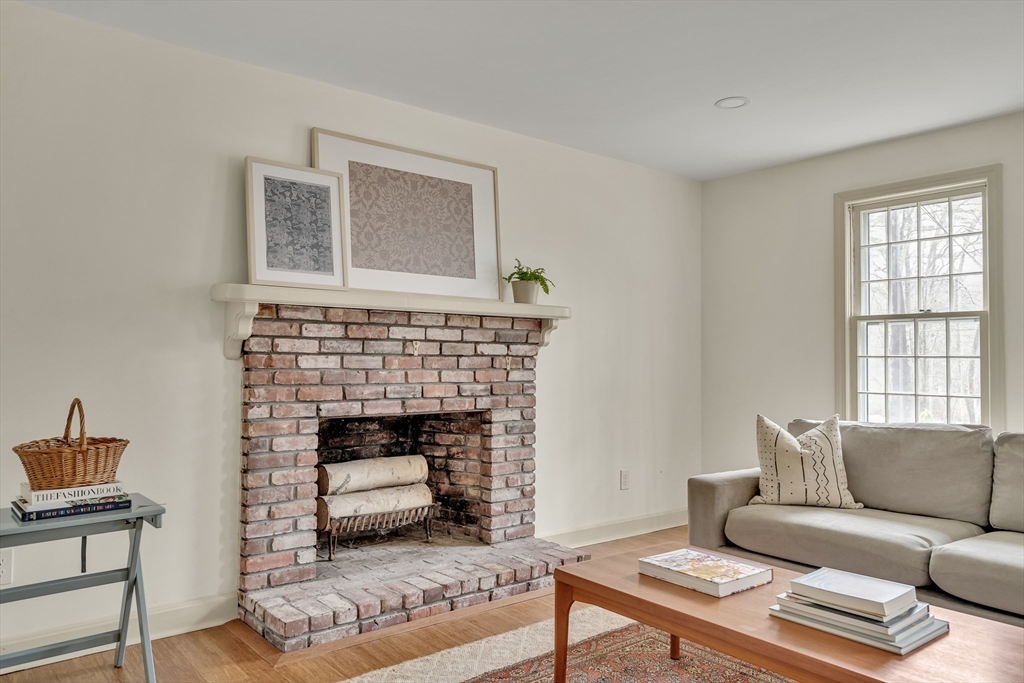 8 Highland Road Acton, MA 01720 - Photo 5 of 36 a living room with furniture and a fireplace