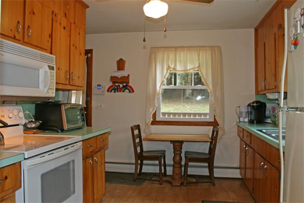 998 New Sherborn Road Athol, MA 01331 - Photo 3 of 10 a kitchen with a table and chairs in it