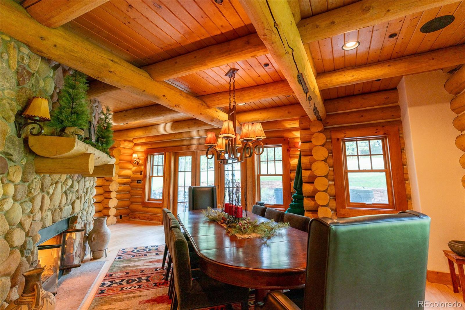375 Pine Creek Road Sedalia, CO 80135 - Photo 17 of 48 a view of a dining room with furniture window and outside view