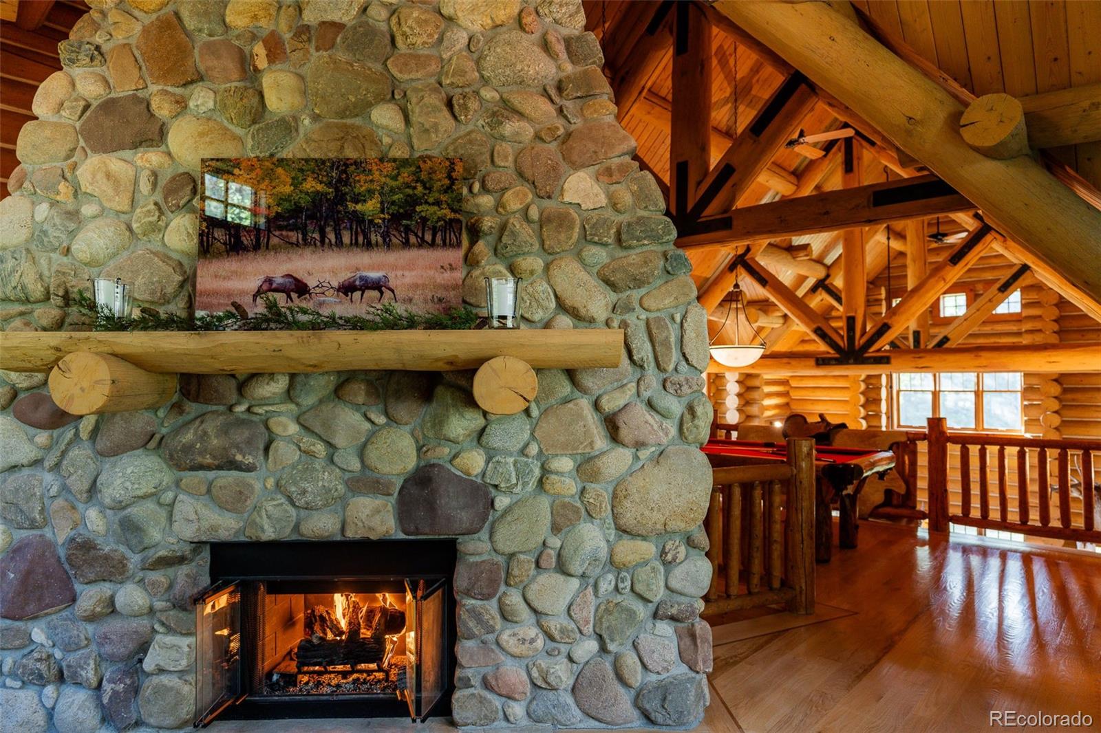 375 Pine Creek Road Sedalia, CO 80135 - Photo 19 of 48 a view of entryway with a fireplace