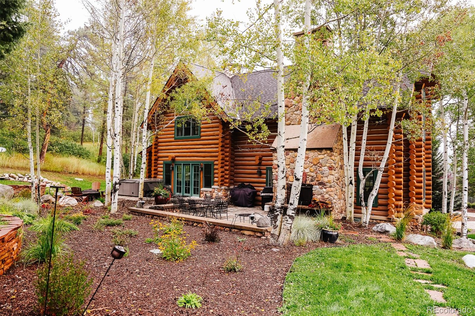 375 Pine Creek Road Sedalia, CO 80135 - Photo 2 of 48 a view of backyard with a patio