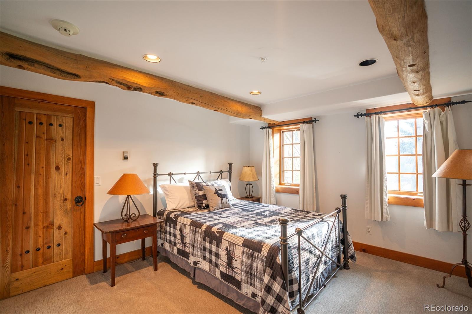 375 Pine Creek Road Sedalia, CO 80135 - Photo 26 of 48 a bedroom with a bed and a window