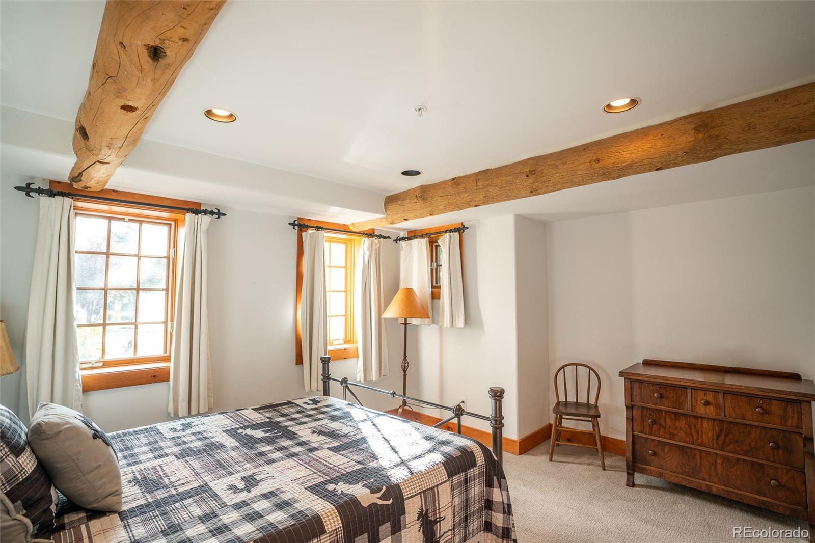 375 Pine Creek Road Sedalia, CO 80135 - Photo 27 of 48 a bedroom with a bed and with furniture