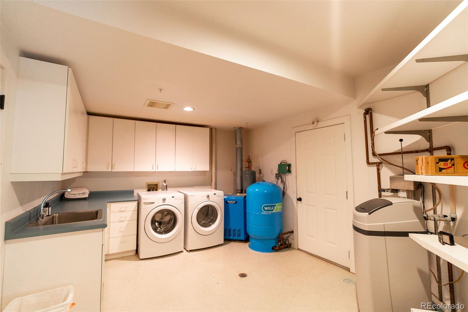 375 Pine Creek Road Sedalia, CO 80135 - Photo 28 of 48 a utility room with dryer and washer
