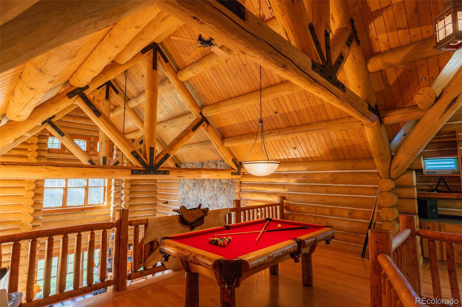 375 Pine Creek Road Sedalia, CO 80135 - Photo 35 of 48 a view of a balcony with red umbrella