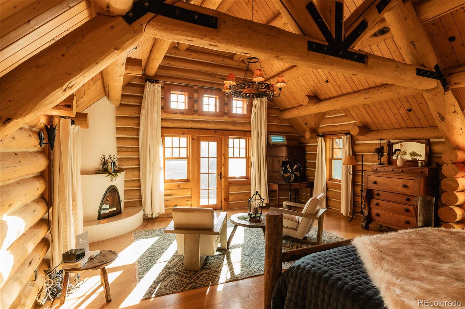 375 Pine Creek Road Sedalia, CO 80135 - Photo 36 of 48 a view of a livingroom with furniture and floor to ceiling window