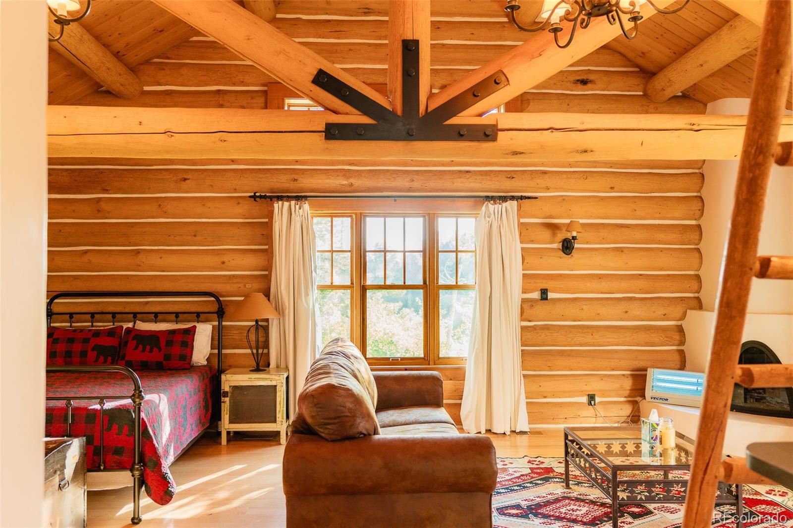 375 Pine Creek Road Sedalia, CO 80135 - Photo 41 of 48 a living room with furniture and a window