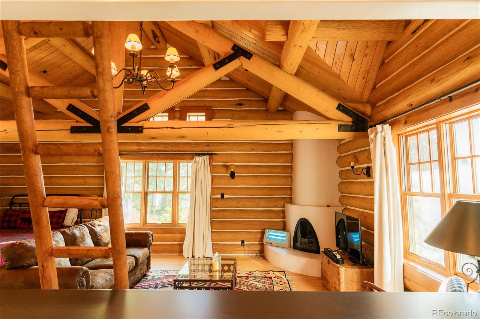 375 Pine Creek Road Sedalia, CO 80135 - Photo 43 of 48 a front view of a house with outdoor seating