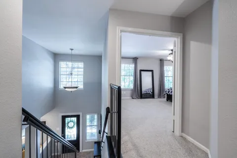 a view of a livingroom with a hall and an entryway