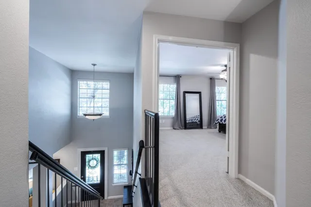 a view of a livingroom with a hall and an entryway