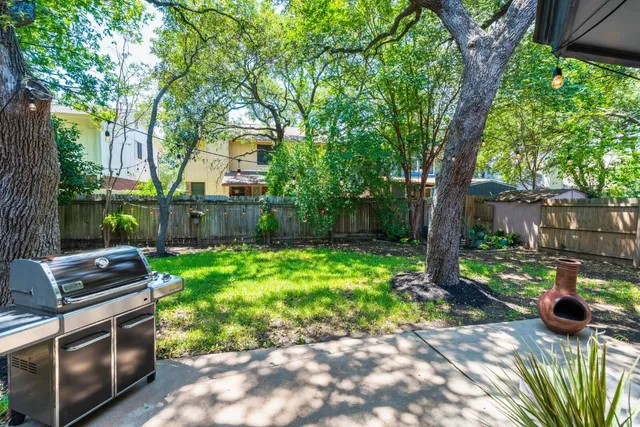 a backyard of a house with lots of green space