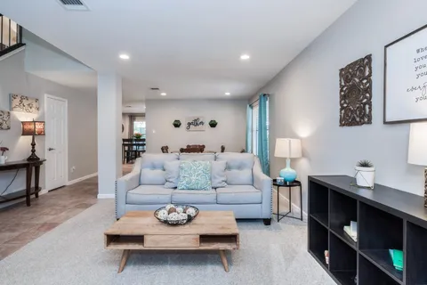 a living room with furniture and a table