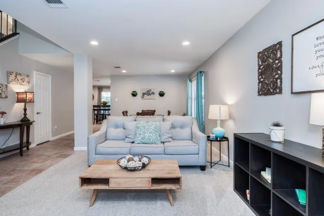 a living room with furniture and a table