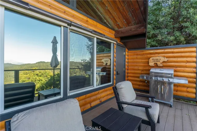 a balcony with furniture and wooden floor
