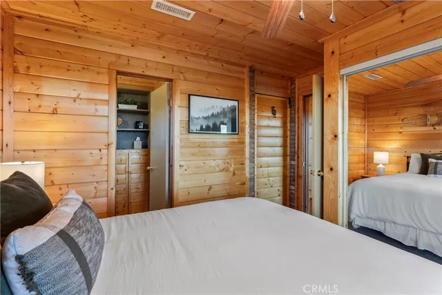 a bedroom with a bed and a table