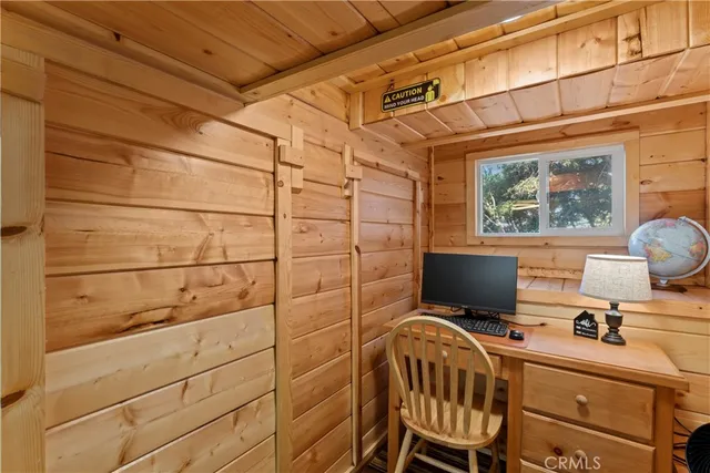 a view of a workspace with furniture
