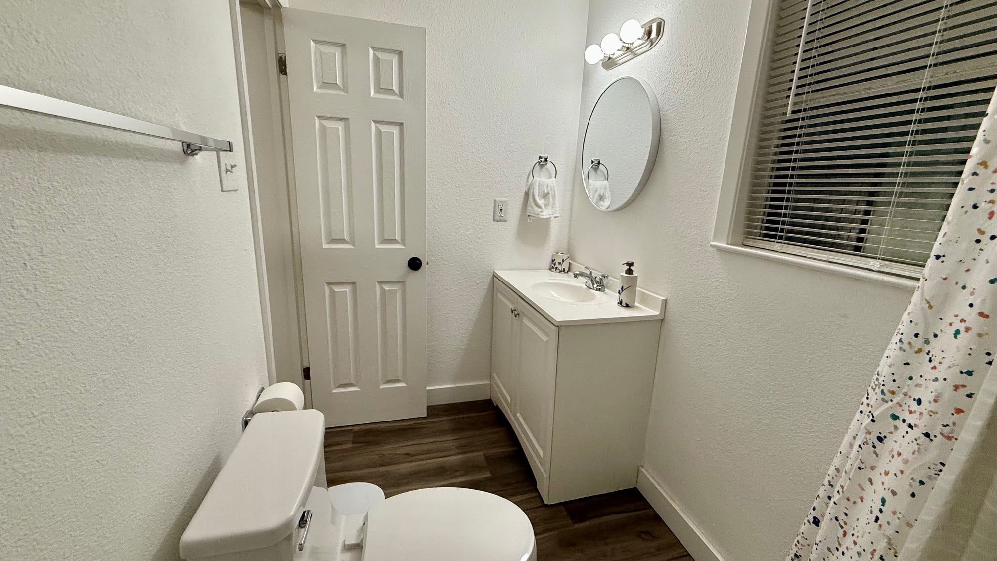 1802 East University Avenue Georgetown, TX 78626 - Photo 11 of 35 a bathroom with a sink a toilet and shower