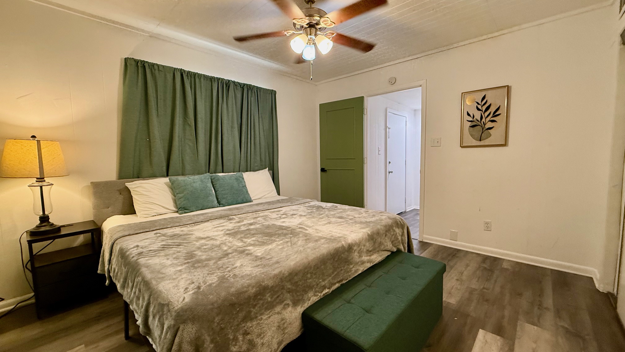1802 East University Avenue Georgetown, TX 78626 - Photo 26 of 35 a bedroom with a bed and a chandelier