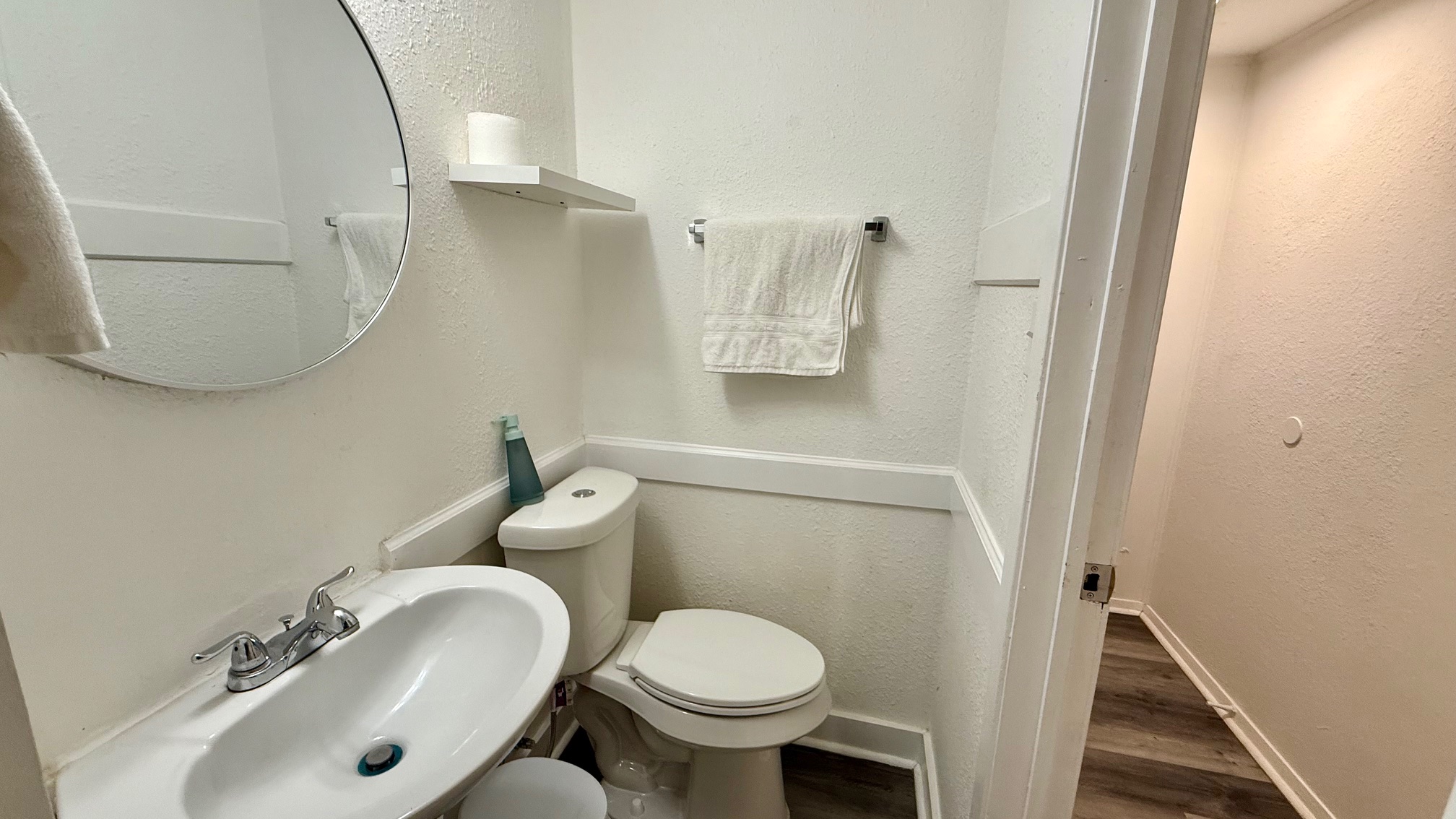 1802 East University Avenue Georgetown, TX 78626 - Photo 9 of 35 a white toilet sitting next to a bathroom sink