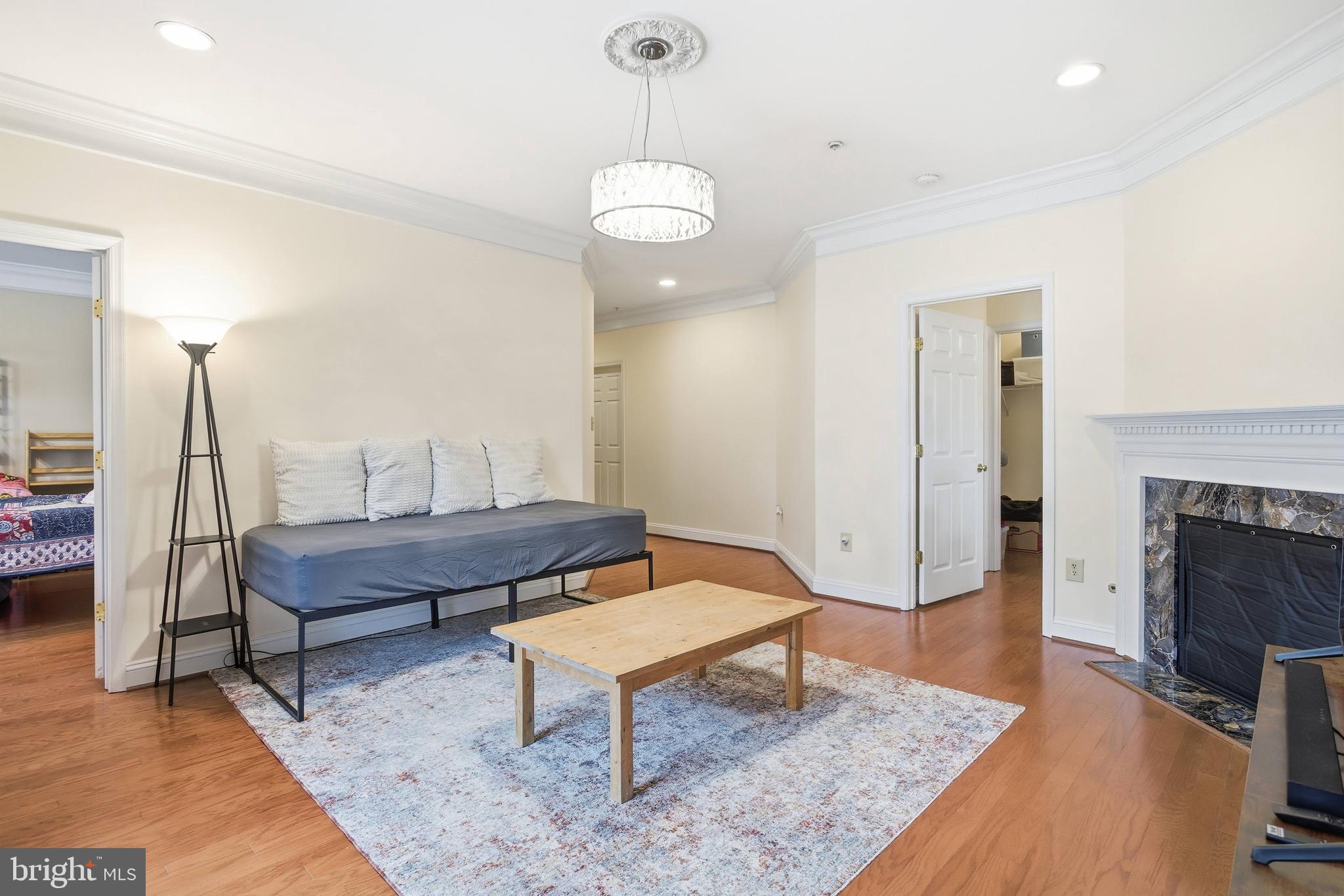 11302 Westbrook Mill Lane, Unit 204 Fairfax, VA 22030 - Photo 20 of 30 a living room with furniture and a fireplace