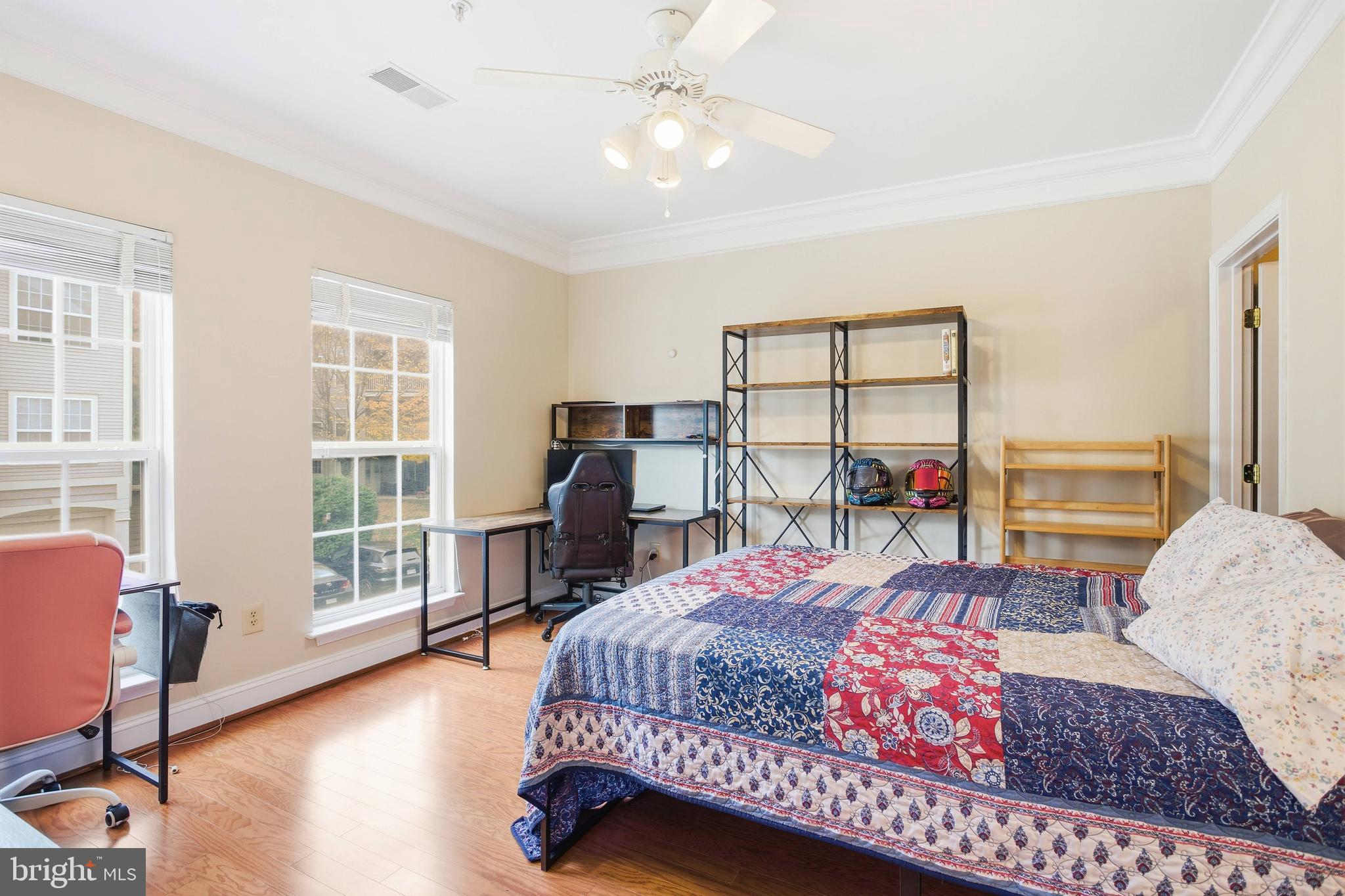 11302 Westbrook Mill Lane, Unit 204 Fairfax, VA 22030 - Photo 24 of 30 a bed room with a bed window and a dresser