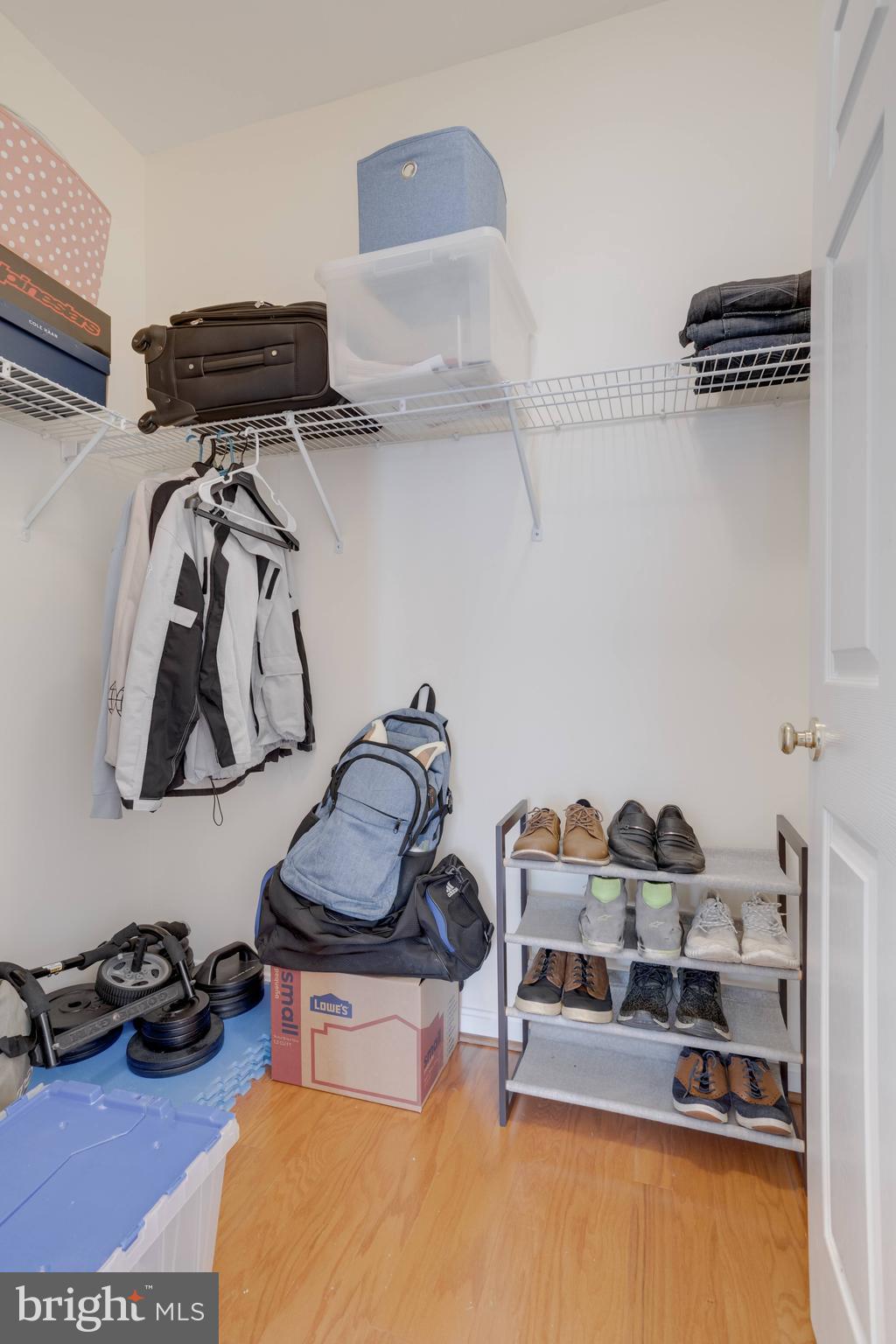 11302 Westbrook Mill Lane, Unit 204 Fairfax, VA 22030 - Photo 30 of 30 a bedroom with a bed and dresser