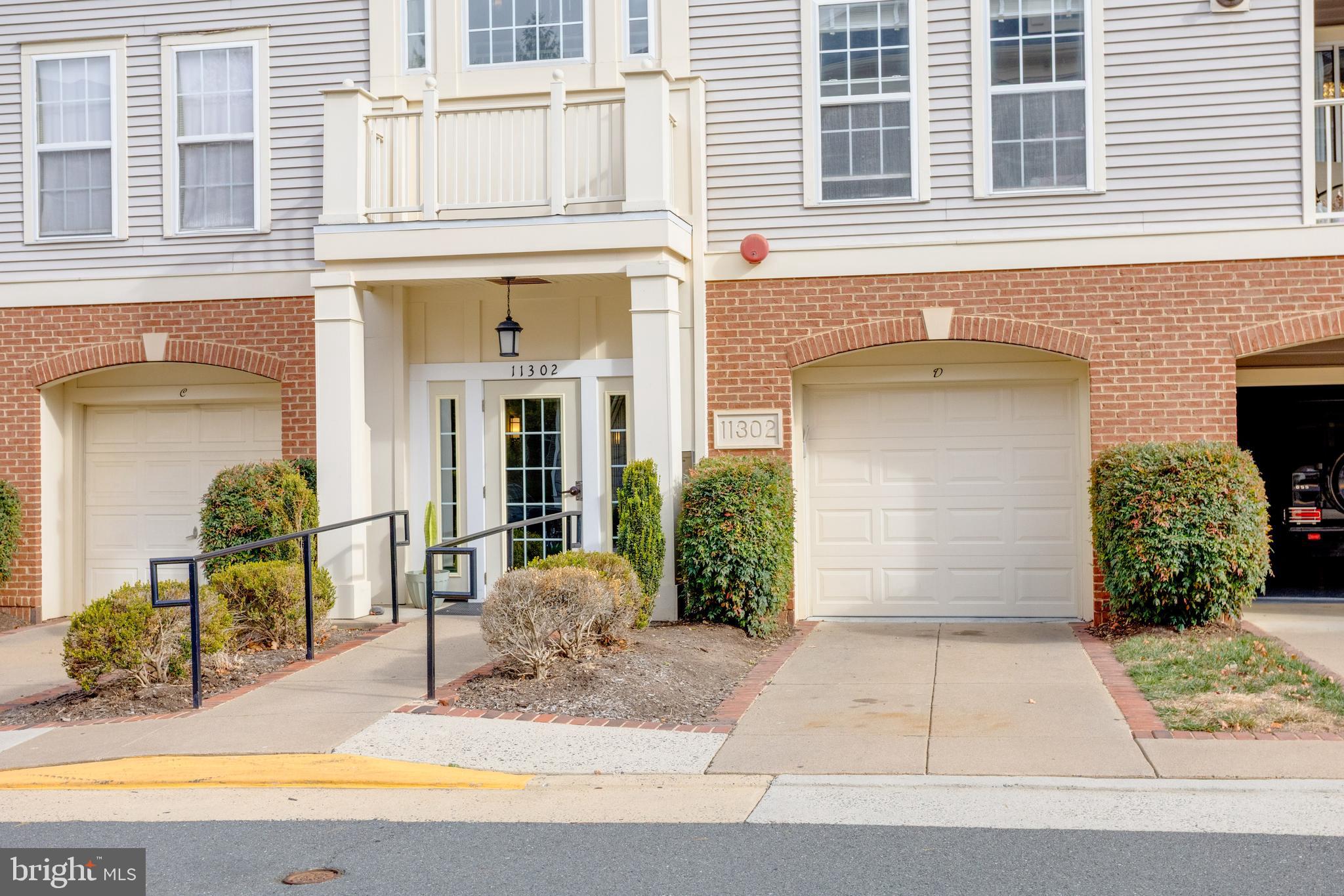 11302 Westbrook Mill Lane, Unit 204 Fairfax, VA 22030 - Photo 3 of 30 a view of a house with potted plants