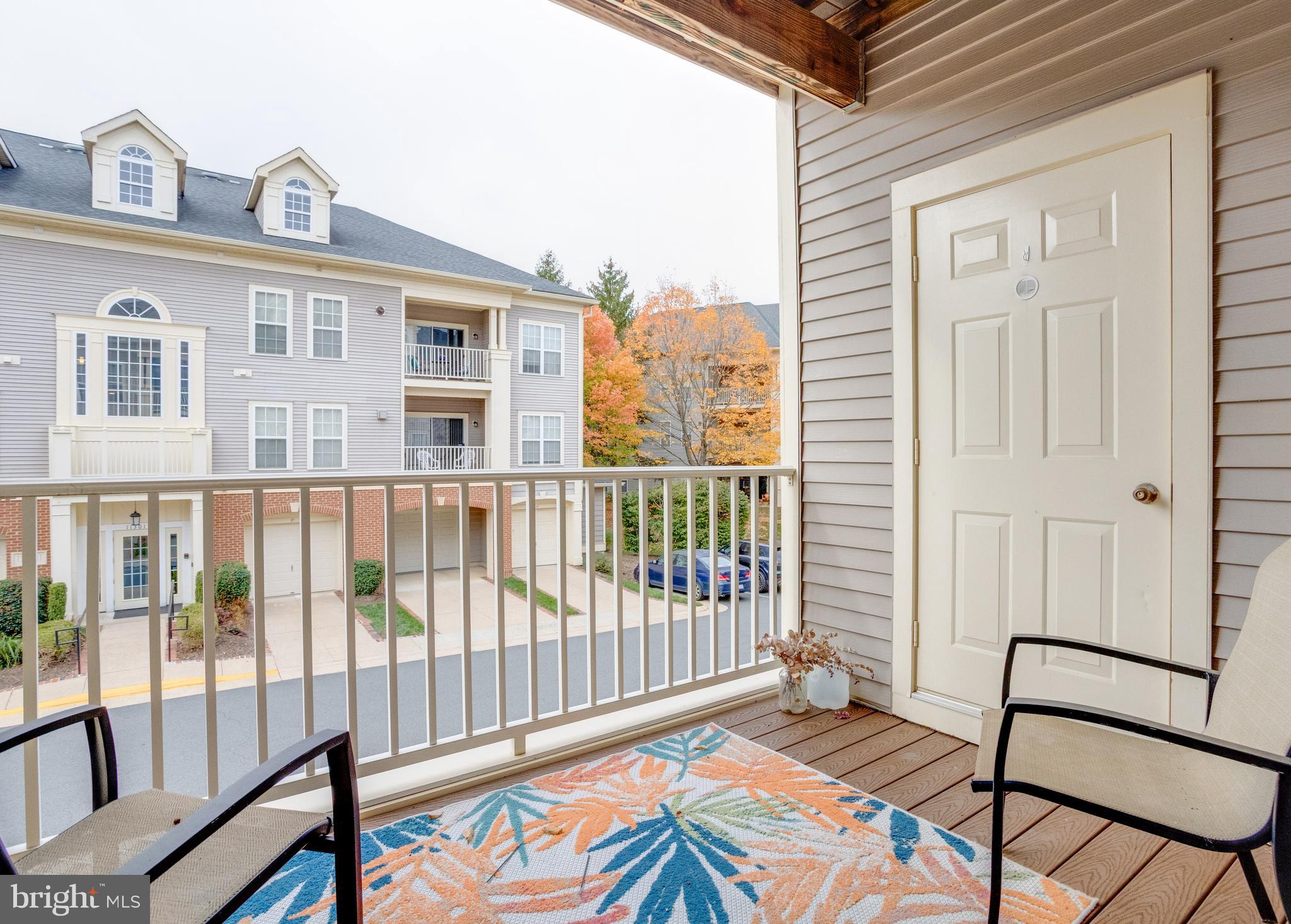 11302 Westbrook Mill Lane, Unit 204 Fairfax, VA 22030 - Photo 4 of 30 a view of a balcony with wooden floor