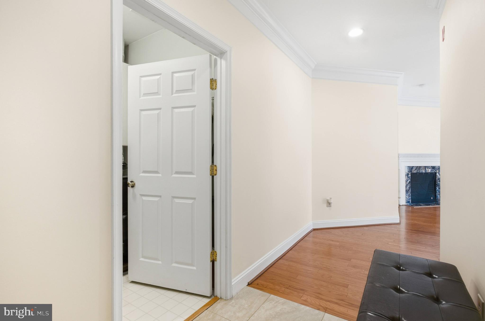 11302 Westbrook Mill Lane, Unit 204 Fairfax, VA 22030 - Photo 10 of 30 a view of a bedroom with wooden floor and cabinet