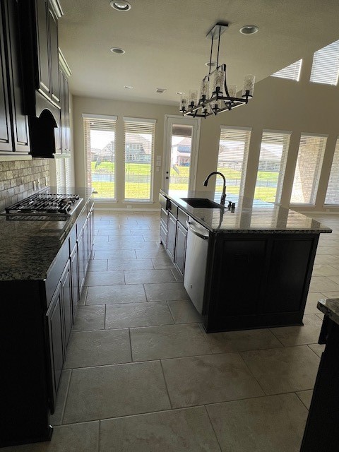 2730 Cutter Court Manvel, TX 77578 - Photo 14 of 39 a kitchen with stainless steel appliances granite countertop a stove a sink dishwasher a refrigerator and a stove with wooden floor
