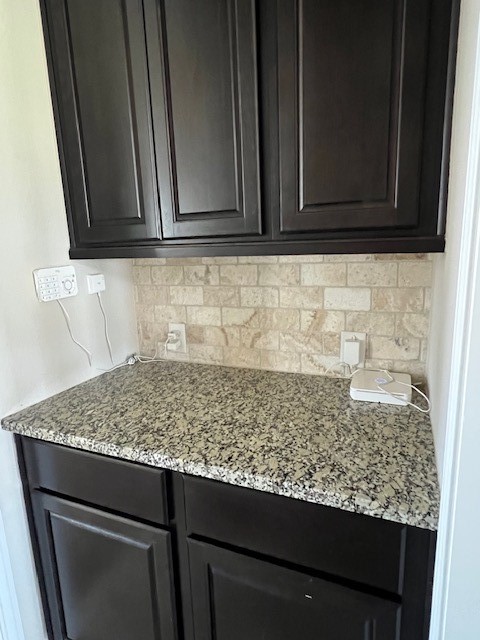 2730 Cutter Court Manvel, TX 77578 - Photo 16 of 39 a sink with granite countertop white cabinets and a sink