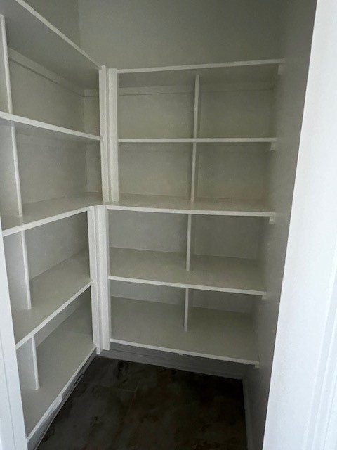 2730 Cutter Court Manvel, TX 77578 - Photo 18 of 39 a view of walk in closet with empty racks