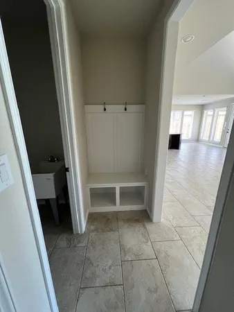 a bathroom with a granite countertop bathtub sink vanity and mirror