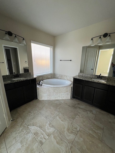 2730 Cutter Court Manvel, TX 77578 - Photo 27 of 39 a bathroom with a bathtub and a sink