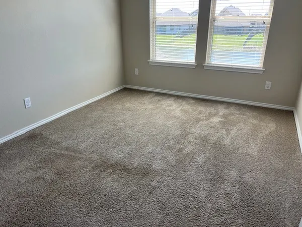 a view of a room that has a window in it
