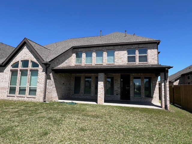 2730 Cutter Court Manvel, TX 77578 - Photo 38 of 39 a view of a house with large windows and a yard