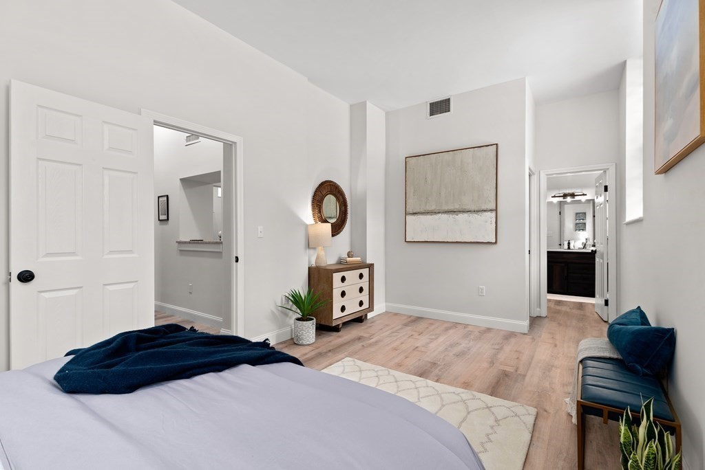 65 Glen Road, Unit H2 Brookline, MA 02445 - Photo 17 of 39 a bedroom with a bed and a dresser