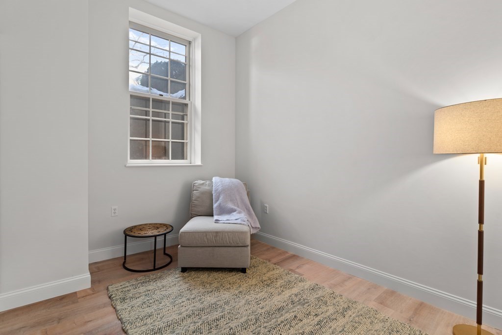 65 Glen Road, Unit H2 Brookline, MA 02445 - Photo 27 of 39 a living room with furniture and a window