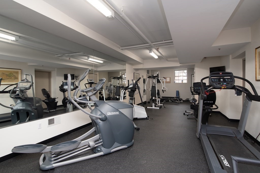 65 Glen Road, Unit H2 Brookline, MA 02445 - Photo 33 of 39 a room with gym equipment and a mirror