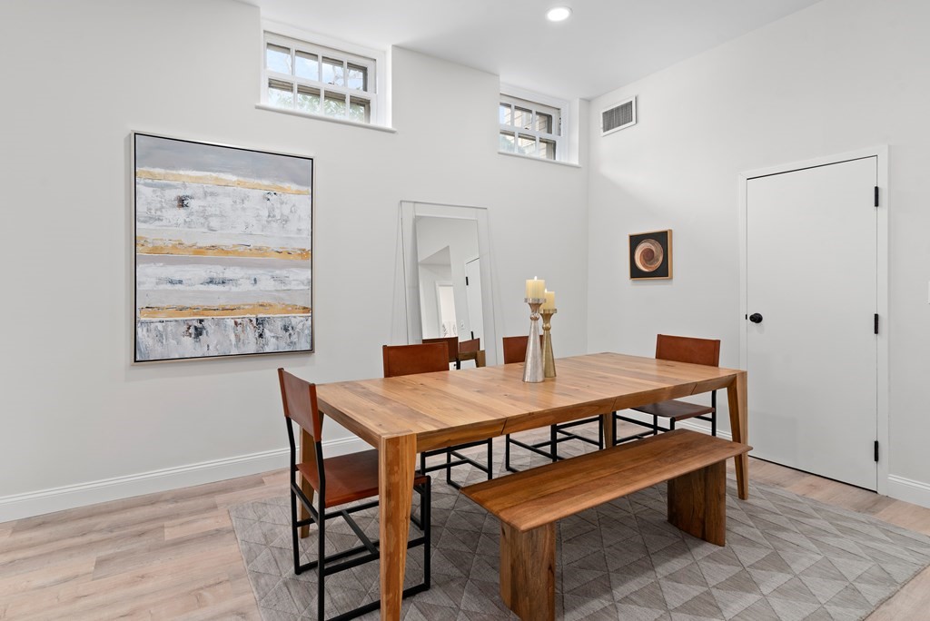 65 Glen Road, Unit H2 Brookline, MA 02445 - Photo 8 of 39 a view of a dining room with furniture and wooden floor