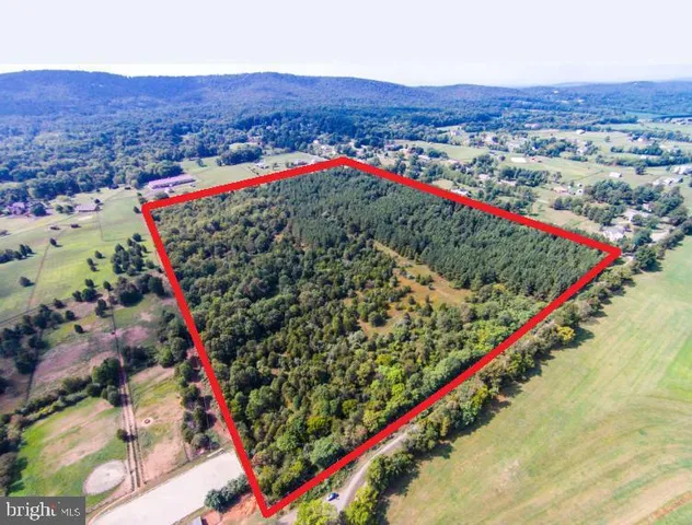 an aerial view of a houses and a road