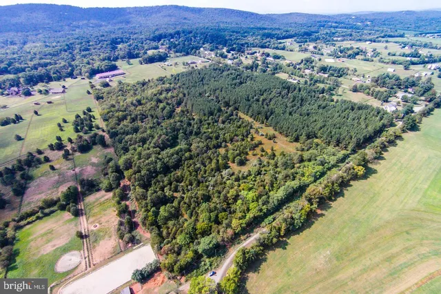 an aerial view of mountain and residential houses