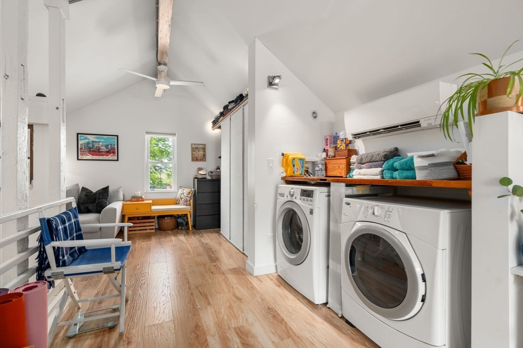 67 Dudley Street, Unit SF Boston, MA 02119 - Photo 13 of 28 a view of livingroom with washer and dryer