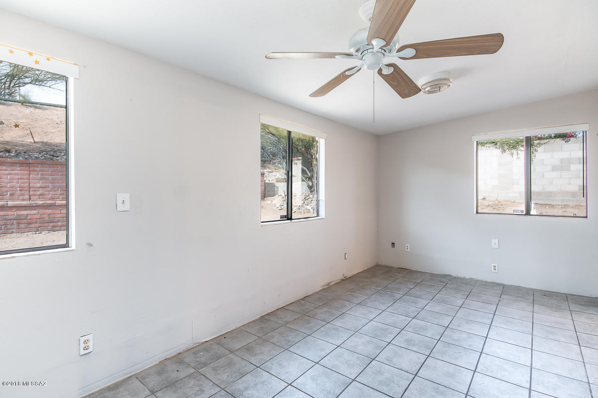 7761 North Rasmussen Avenue Tucson, AZ 85741 - Photo 14 of 23 a view of an empty room with a window