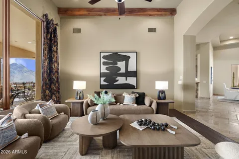 a living room with furniture potted plant and a fireplace