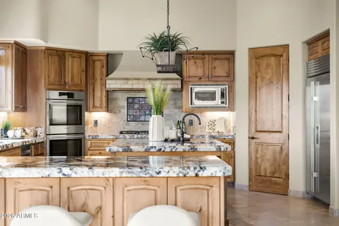 a living room with furniture large window and flat screen tv