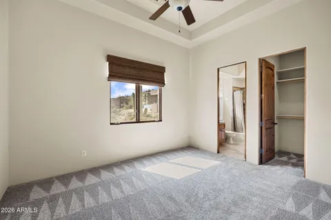 a bathroom with a granite countertop sink mirror toilet and bathtub